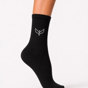 Black ribbed mid-calf sock on a leg with a white wing-like logo on the side.
