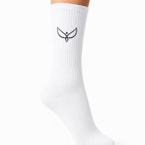 White knee-high sock on a leg with a small black bird logo on the shin area, ribbed texture visible against a white background