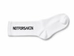 White sock with a ribbed cuff, lying flat, and the black text NOT FOR SAKEN printed on the side